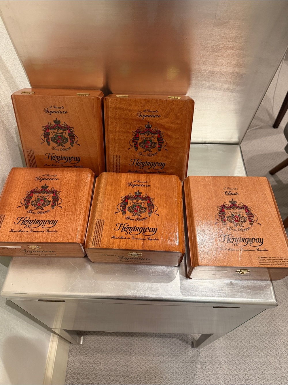 Set of 5 Hemingway wooden cigar boxes $75